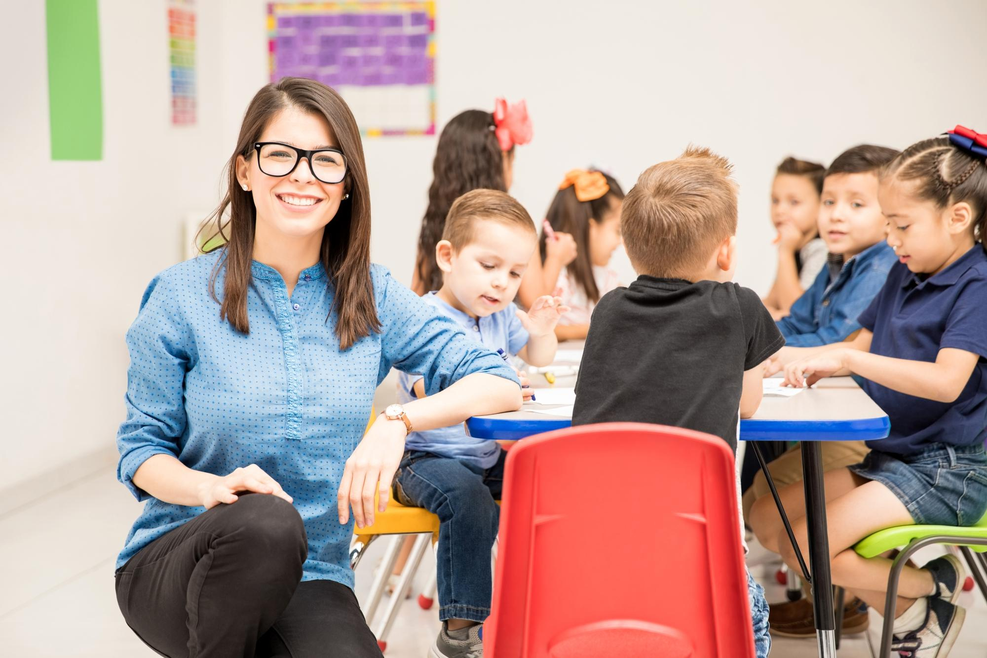 portrait-gorgeous-hispanic-preschool-teacher-loving-her-job-having-fun-with-her-pupils
