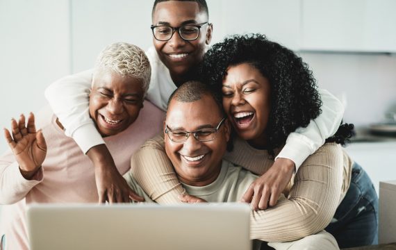 happy-black-family-doing-video-call-home-main-focus-father-face